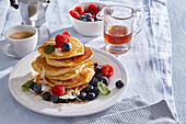 Pancakes with fresh berries and honey