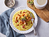 Saffron risotto with prawns and pomegranate seeds