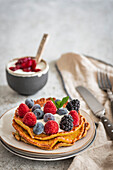 Pancakes with cream and fresh berries