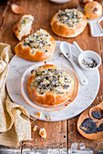 Baked yeast and onion rolls with poppy seeds