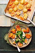 Parmesan potato crusties served with lamb's lettuce and pears