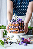 Naked cake with blackberry buttercream