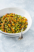 Lentil salad with carrots, sesame seeds and parsley
