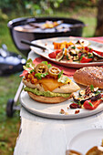 Grilled Texmex burgers with chicken, avocado and jalapeño