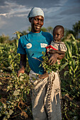 Woman harvesting produce, Kenya