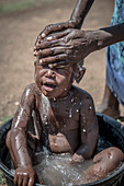 Mother bathing her child, Kenya