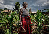 Woman looking at her garden, Kenya