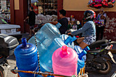 Empty water bottles on cart