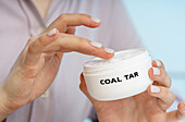 Coal tar medical cream, conceptual image