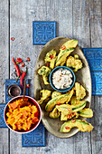 Avocado and broccoli pakoras with mashed pumpkin and coconut chutney