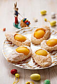 Puff pastry pockets with peaches in Easter egg shape