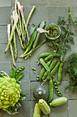 Green spring vegetables - asparagus, peas, courgettes, romanesco