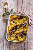 Potato and chicory casserole with mustard and cheddar sauce