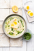 Asparagus soup with wild garlic, egg and pesto