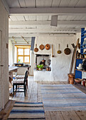 Rustic kitchen with rustic copper pans and wooden floor