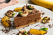 Chocolate mousse tart with bananas and oranges