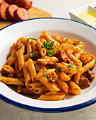 Macaroni with tomato sauce and chorizo