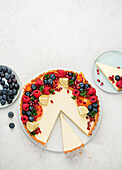 Pannacotta tart with fresh berries and citrus fruits
