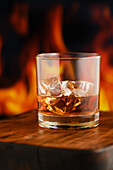 Whisky on the Rocks in front of a flickering fire