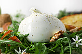 Burrata on rocket salad with pear and walnuts