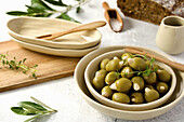 Green olives stuffed with almonds in small bowls