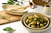 Green olives filled with almonds in small bowls