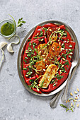 Fried halloumi on marinated red peppers