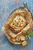 Baked feta with tomatoes and pine nuts