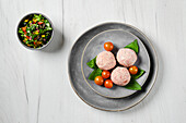 Raw veal meatballs with basil and cherry tomatoes