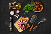 Still life with raw lamb ribs, herbs and spices