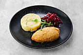 Kiev cutlet with mashed potatoes and beetroot salad