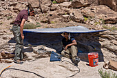Paleontologists working in excavation site, Utah, USA
