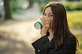 Teenage girl drinking coffee