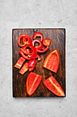 Red pepper pieces on a cutting board