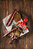 Smoked, air-dried venison sausage with tomatoes
