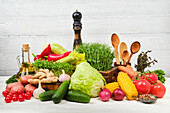 Various vegetables against a white wooden background