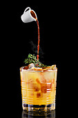Espresso tonic with orange syrup and thyme