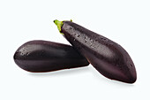 Two aubergines against a white background
