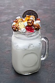 Freak shake with marshmallows, jelly babies and popcorn