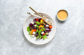 Roasted vegetable salad with feta and herb dressing