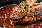 Fried porterhouse steak with red wine sauce