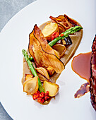 Black Angus steak with aubergine caviar and green asparagus