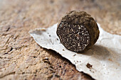 Sliced black truffle on paper