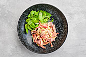 Overhead view of salad with pulled beef and vegetables