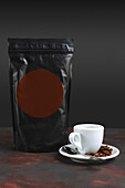 Espresso with coffee beans and packet of coffee