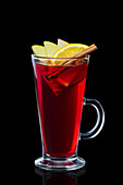 Hot mulled wine with cinnamon and fruit slices