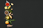 Various herbs and spices on a black background