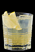 Pineapple spritz with lemon slices and ice cubes