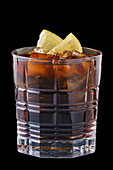 Cola with ice cubes and lemon slices
