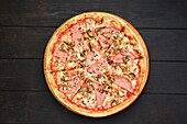 Pizza with beef ham and mushrooms